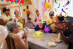 Assisted living residents singing happy birthday in Brevard, NC - Tore's Home Inc